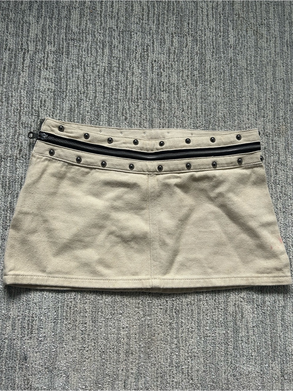 Edikted Beige Micro-Mini Skirt with Studded Waist and Black Zipper Trim